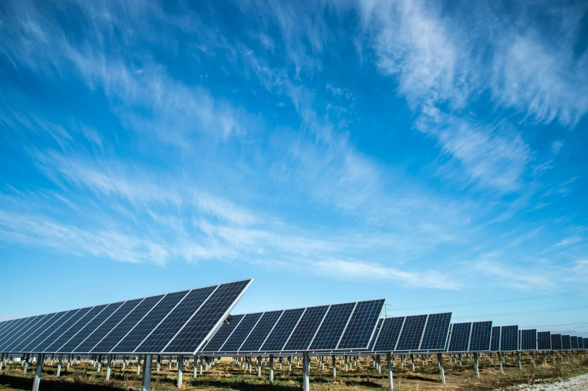 Aerial view of a massive utility-scale solar array under construction