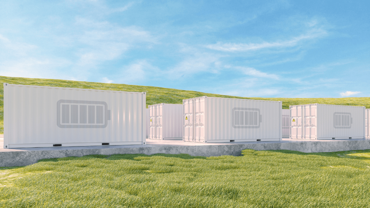 Large scale battery energy storage system containers in an outdoor utility-scale facility.