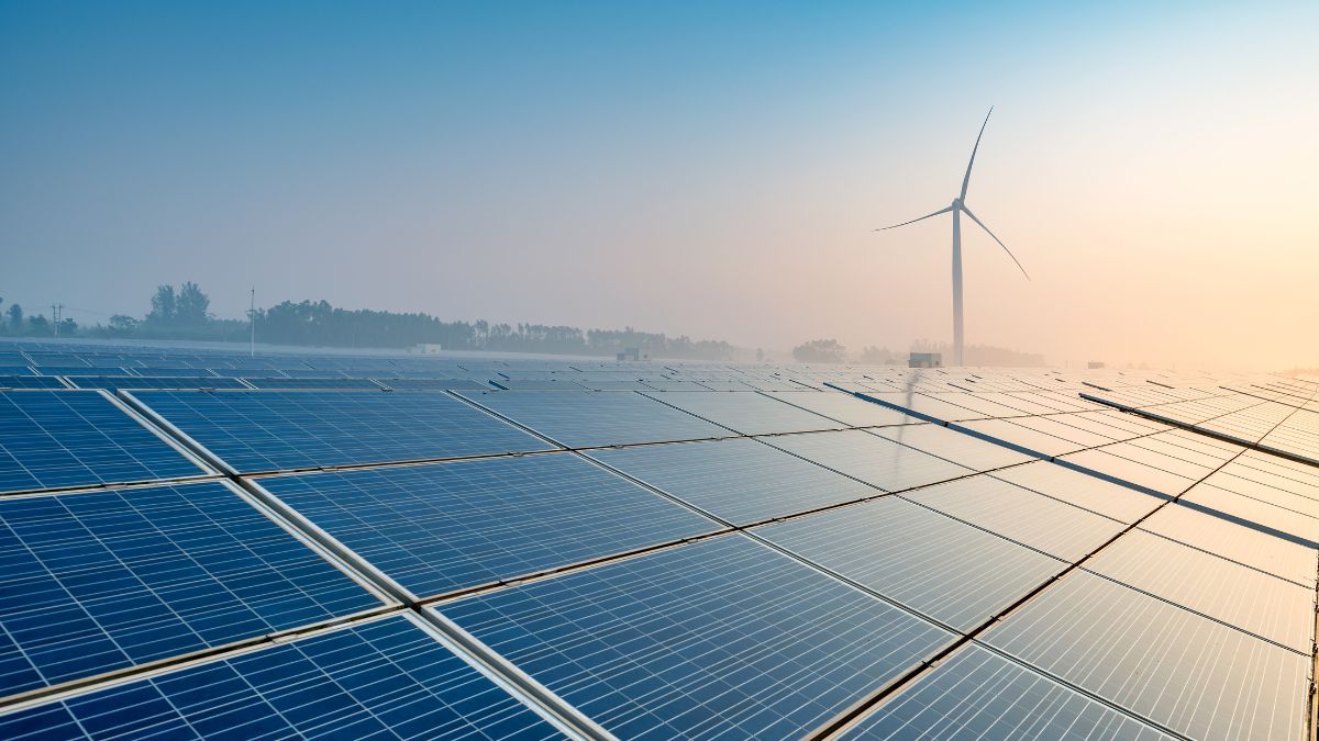 Large scale solar farm construction in a rural landscape with utility infrastructure