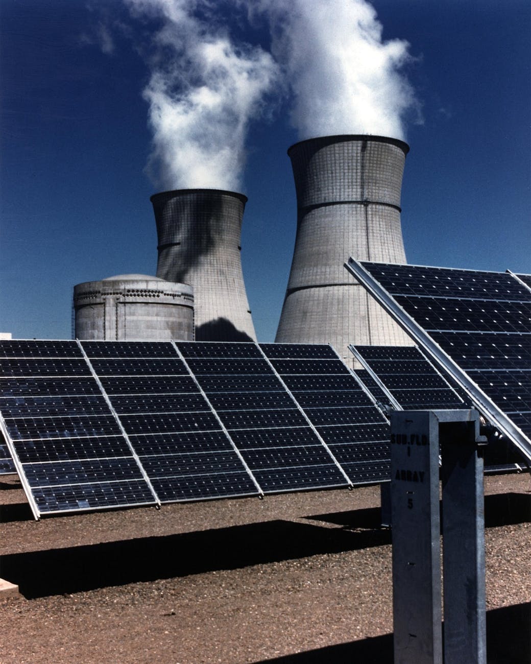 Industrial solar panels installed at a large mining facility with hybrid power infrastructure.