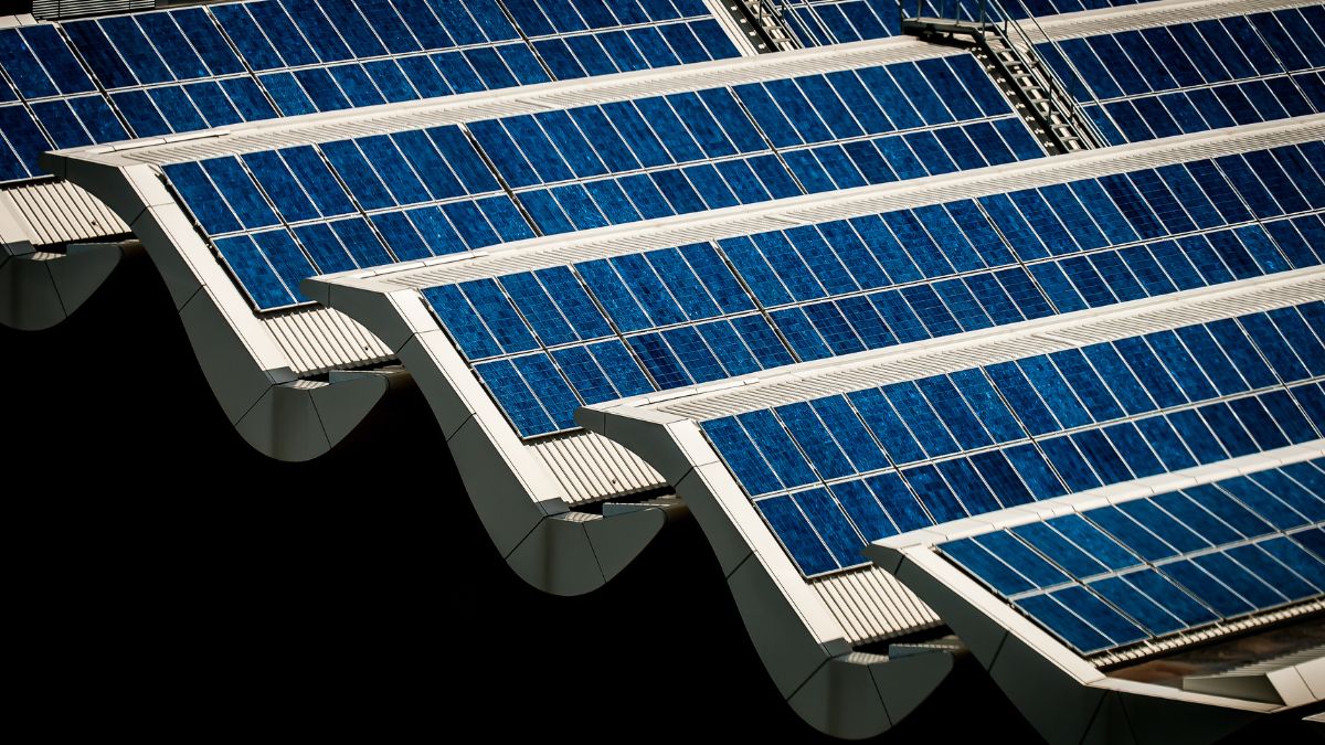 Aerial view of a commercial airport terminal with potential for rooftop solar installation
