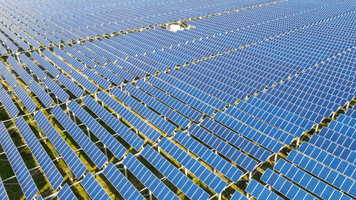 Abstract solar energy representation with solar panels and grid infrastructure
