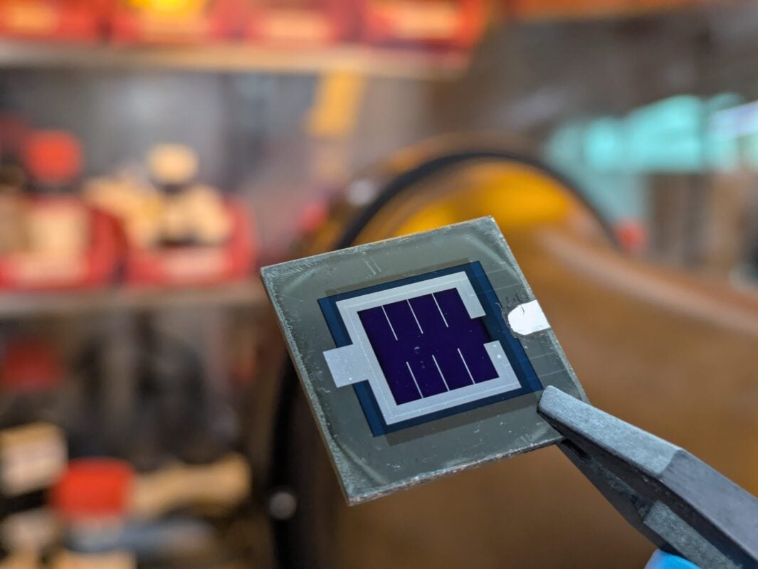 Microscopic view of thin-film solar cell layers showing CIGS and perovskite tandem structure