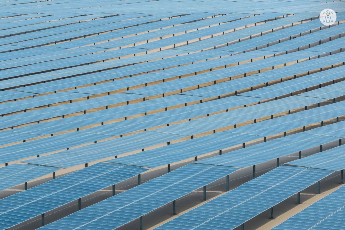 Logos of TotalEnergies and Masdar side by side, symbolizing a major energy partnership.