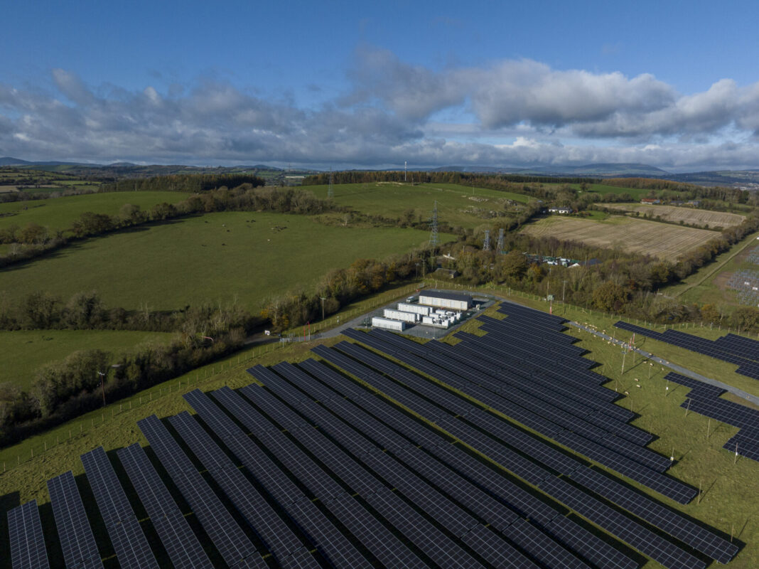 Aerial view of a European residential neighborhood with rooftop solar panels installed