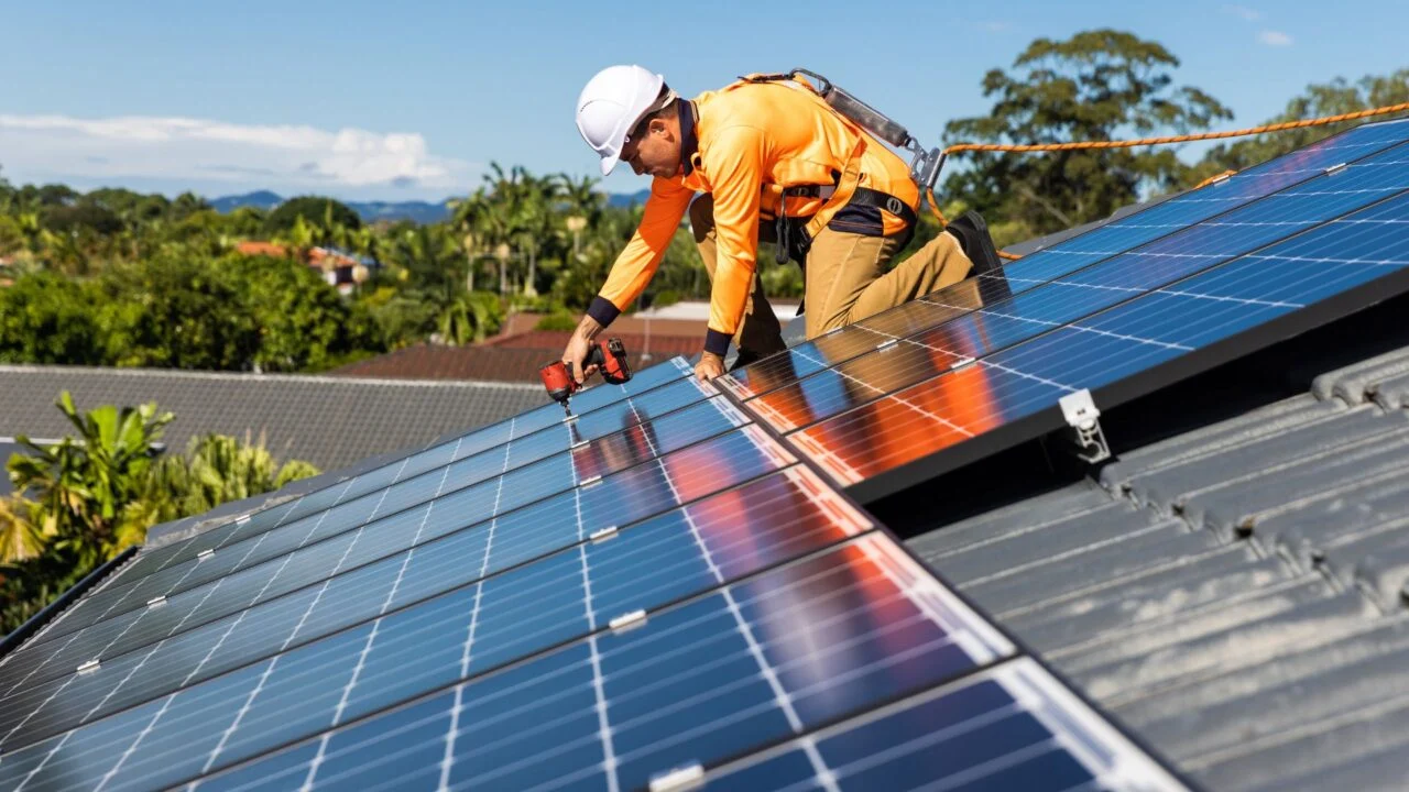 Aerial view of a large commercial solar rooftop installation in industrial France.
