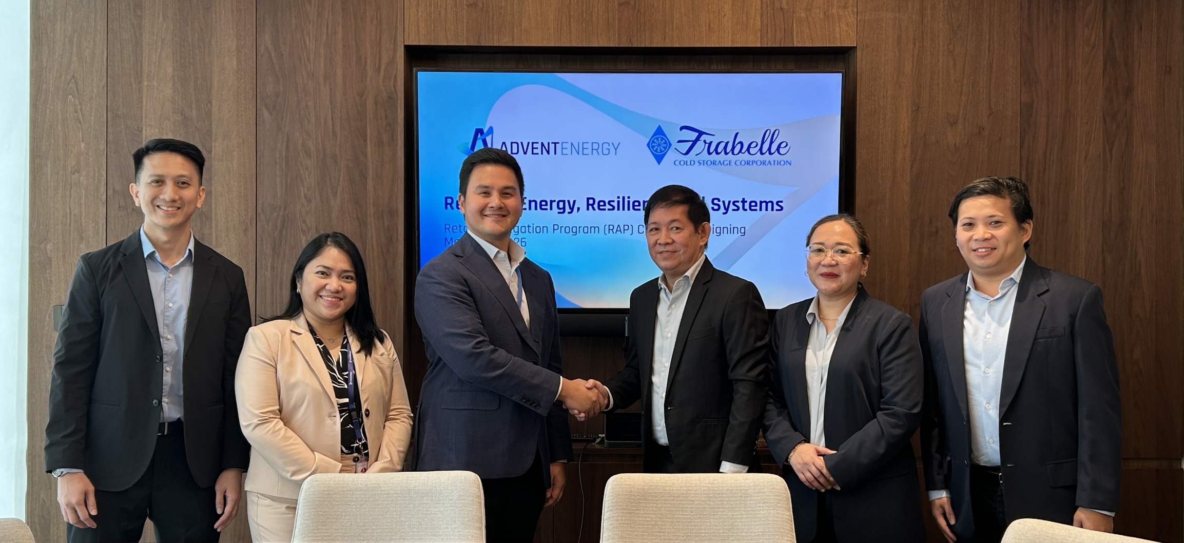 Ceremonial signing event between AdventEnergy and Frabelle for a retail aggregation solar project.