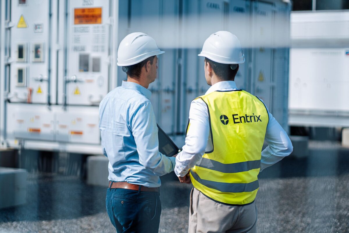 A modern European battery storage system installation in a residential garage setting.