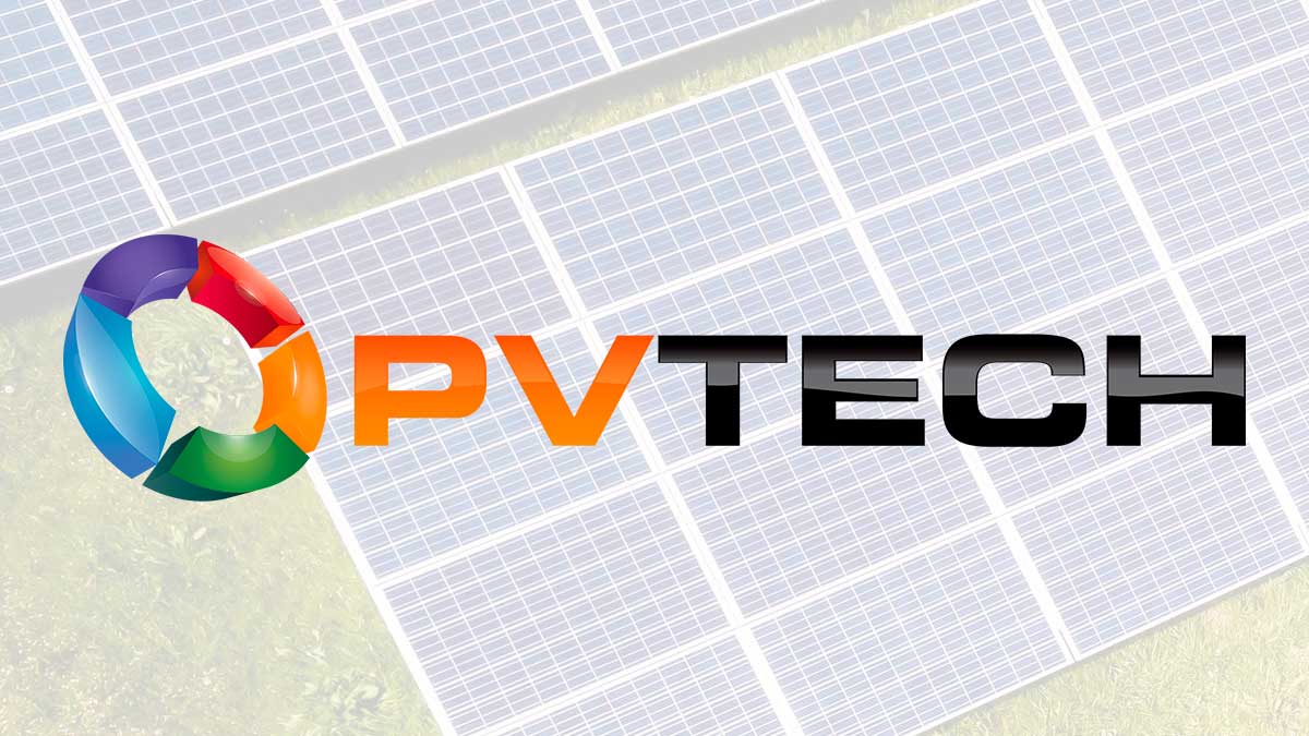Aerial view of a massive utility-scale solar plant with integrated battery storage units.