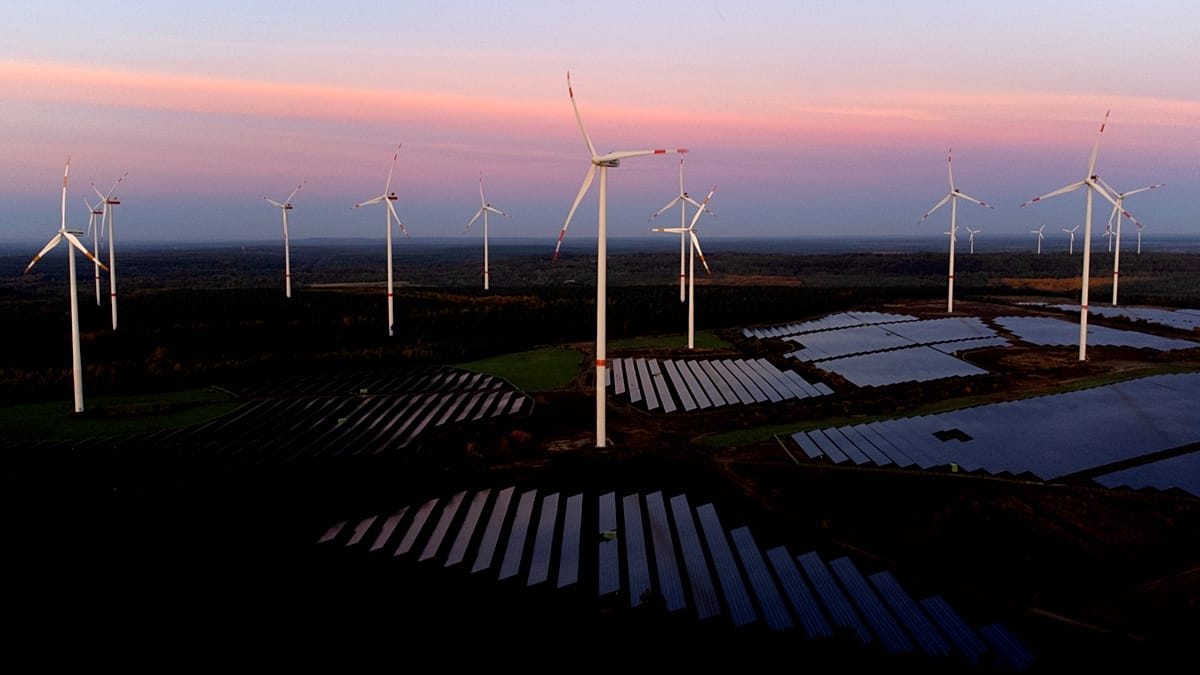 Technicians working on a modern electrical substation grid infrastructure for solar energy integration in Europe