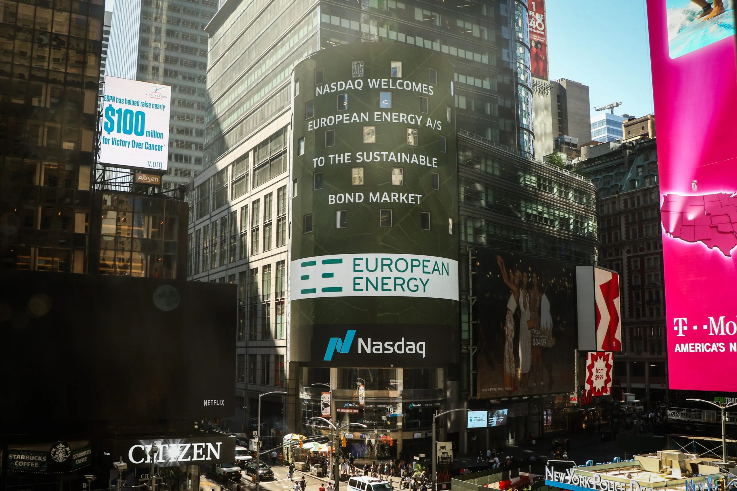 A digital display showing financial market data with a green energy theme.