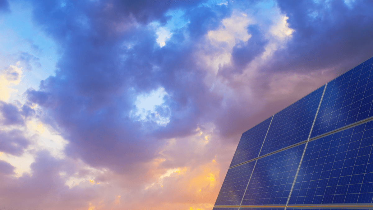 Large-scale solar array and battery storage containers in a vast desert landscape